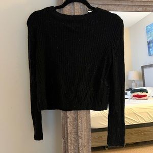 Black sweater. Size M. 47% acrylic, 30% nylon, 20% rayon, 3% spandex.